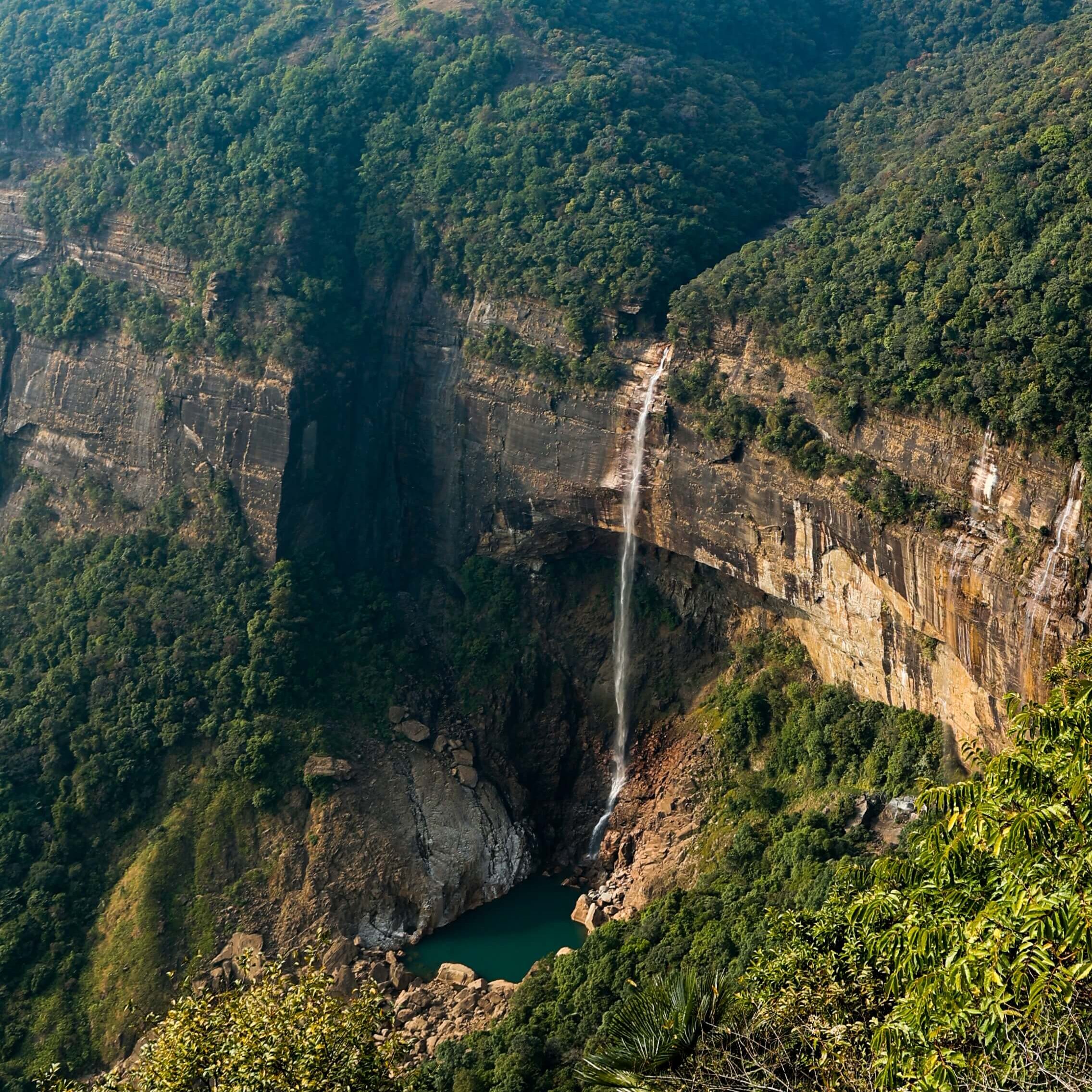 Nohkalikai Falls Cascadig Down from the Mountain Cliff.